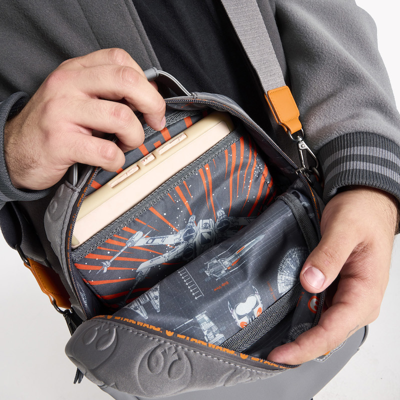 Close up image of the Loungefly COLLECTIV Star Wars Rebel Alliance The EVRYDAY Convertible Bag, showing the inside of the bag with a sleeve where a tablet fits 